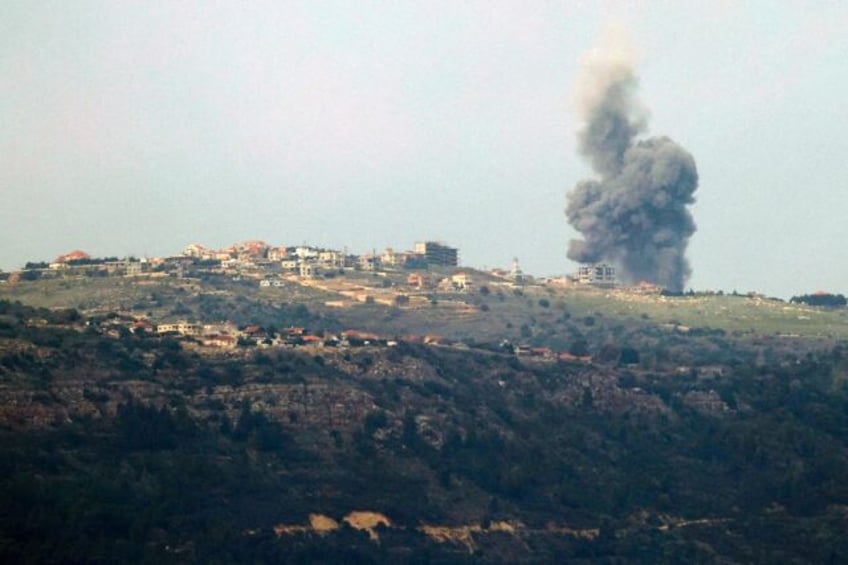 Smoke billowing over the Lebanese village of Markaba, near the Israeli border, following reported strikes