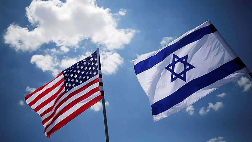 American and Israeli flags are seen during a dress rehearsal of the arrival ceremony which will be held to welcome U.S. President Donald Trump upon his arrival, at Ben Gurion International Airport in Lod, Israel May 21, 2017. REUTERS/Amir Cohen - RC116816C0C0