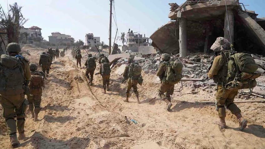 israels military reopens gaza evacuation route as troops surround gaza city