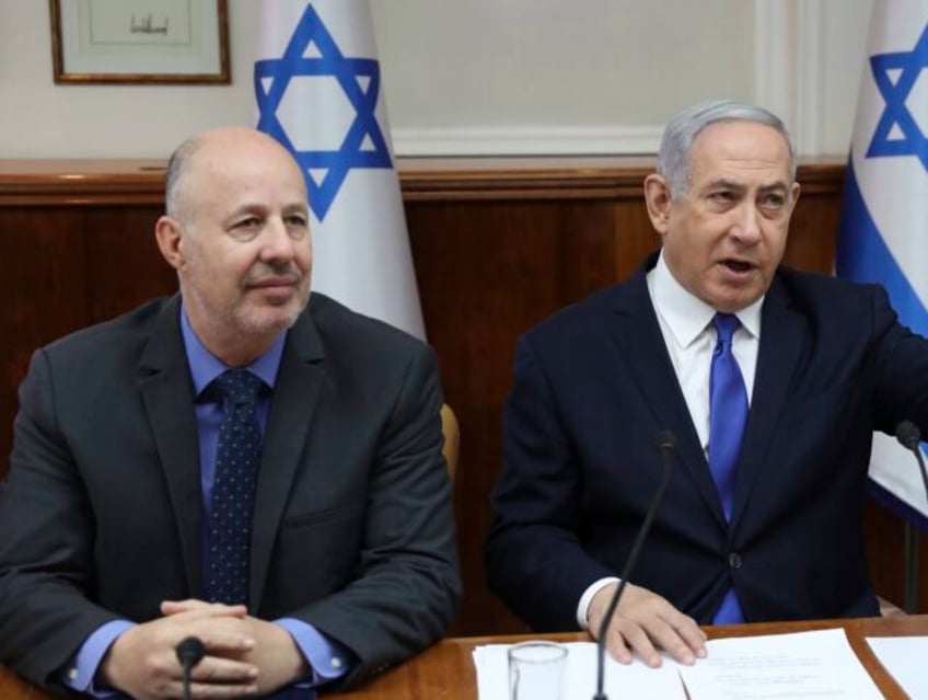 Israeli Prime Minister Benjamin Netanyahu, center, Minister for Regional Cooperation Tzach