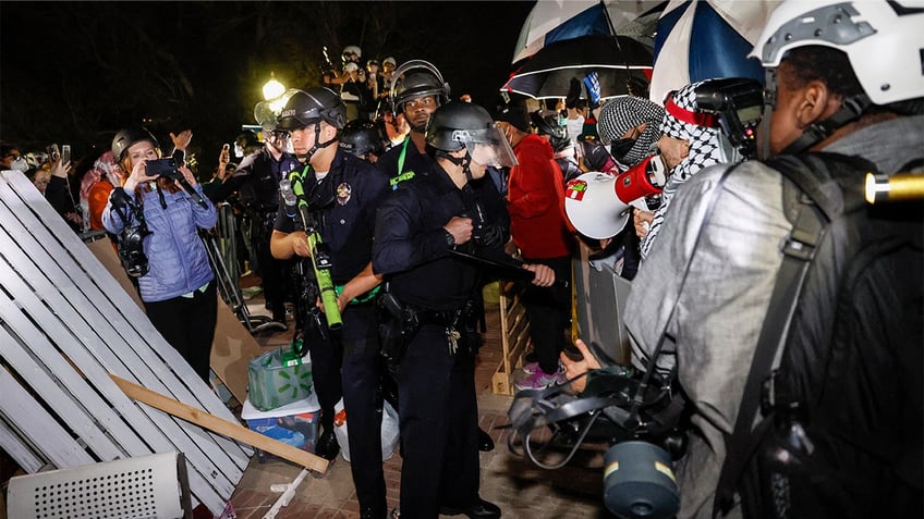 Police officers, protesters