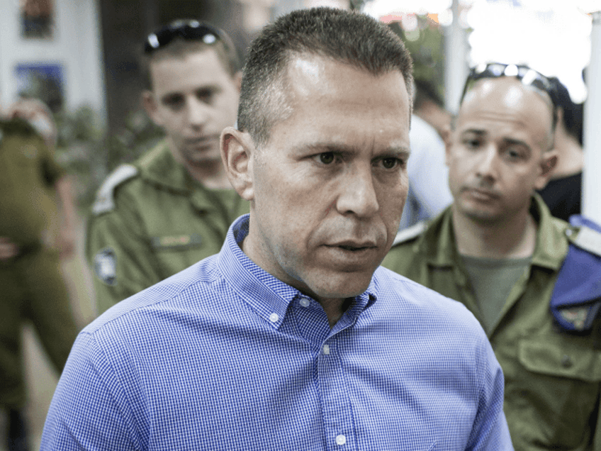 Gilad Erdan, the Minister of Communications and Home Front Protection, speaks with a soldi