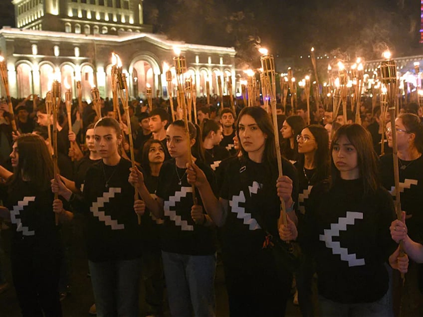 Armenians take part in a torchlight procession in Yerevan, late on April 23, 2023, to mark the 108th anniversary of World War I-era mass killings. - Armenians mark the 108th anniversary of the massacres in which they say some 1.5 million ethnic Armenians were killed during World War I as the Ottoman Empire collapsed. Armenians have long sought to have the killings internationally recognised as a genocide, with the support of many other countries, but this has been fiercely rejected by Turkey. (Photo by KAREN MINASYAN / AFP) (Photo by KAREN MINASYAN/AFP via Getty Images)