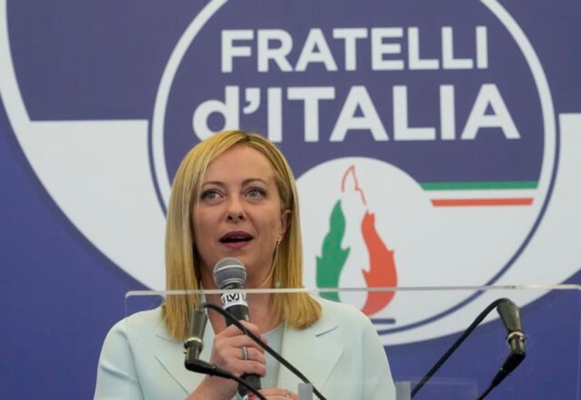 italian leader tones down divisive rhetoric but carries on with pursuit of far right agenda