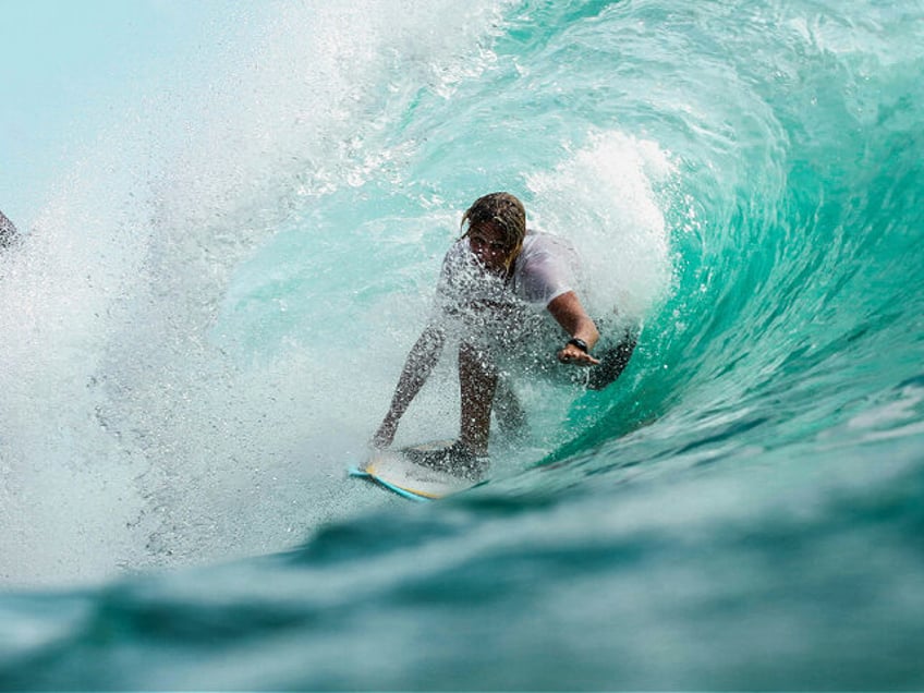 time lapse photography surfer in wave water