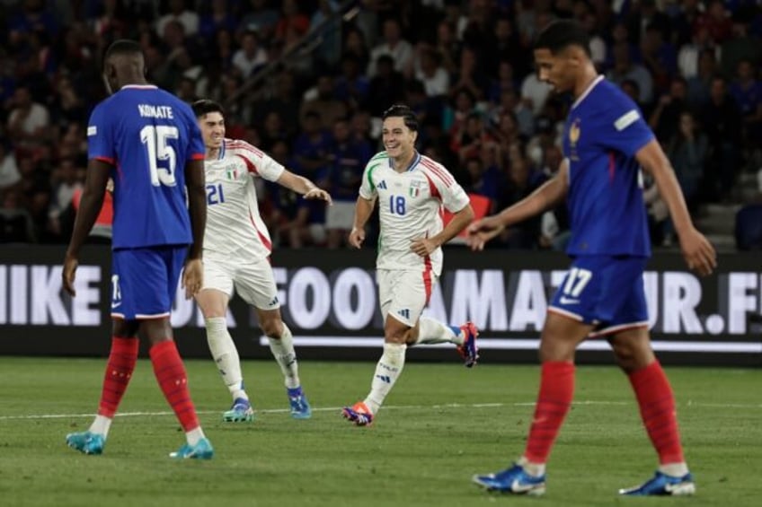 Giacomo Raspadori celebrates after scoring Italy's third goal against France in Paris