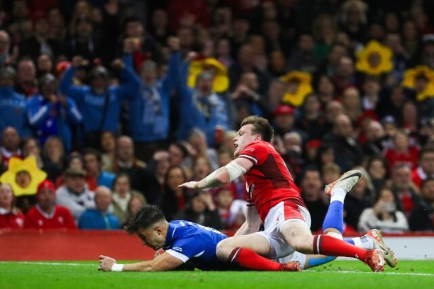 Excellent score: Italy full-back Lorenzo Pani (under L) dives across the line to score a t