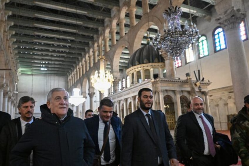 Italian Foreign Minister Antonio Tajani (2nd L) visits the eighth-century Umayyad Mosque i