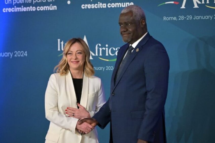 Italy's Prime Minister, Giorgia Meloni welcomes Chairperson of the African Union Commission Moussa Faki Mahamat as he arrives for the Italy-Africa international conference 'A bridge for common growth’ at the Italian Senate in Rome on January 29, 2024.