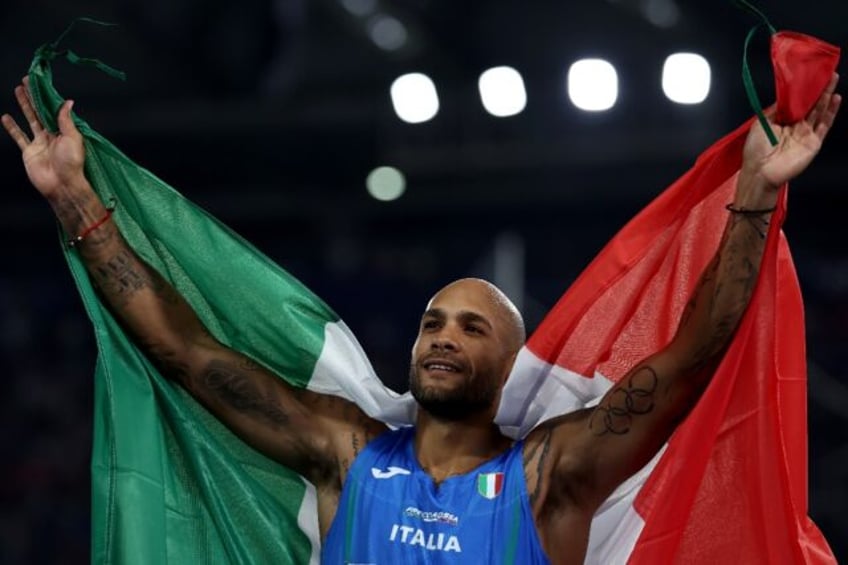 Italy's Marcell Jacobs celebrates after winning gold medal in the men's 100m final at the