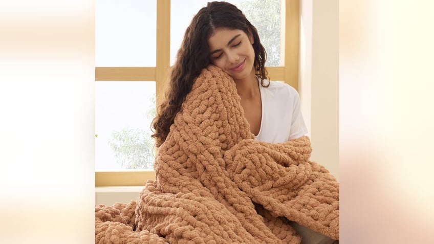 Cozy up under this chenille blanket.