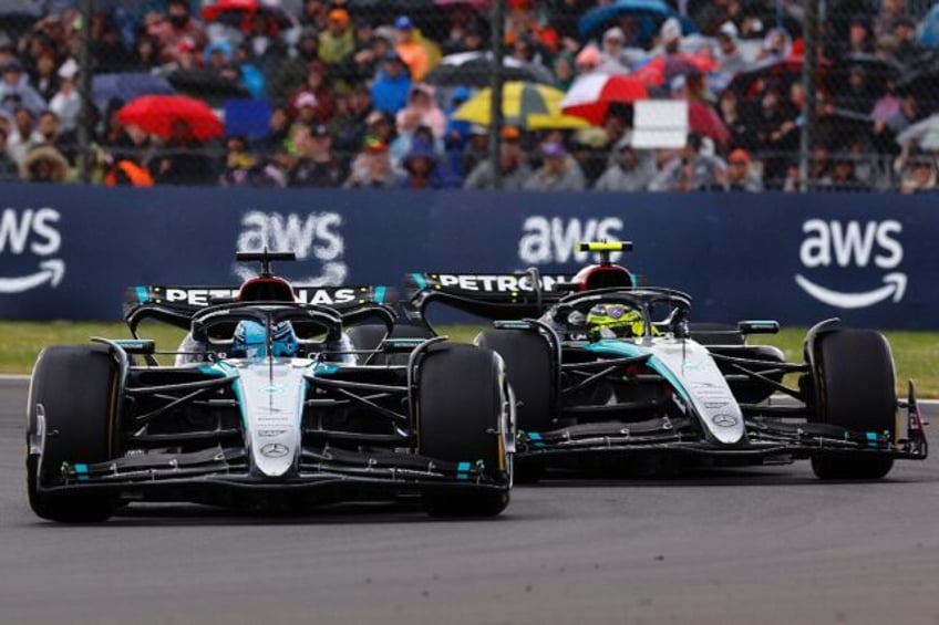 Mercedes' drivers Lewis Hamilton and George Russell (L) competing at the Formula One Briti