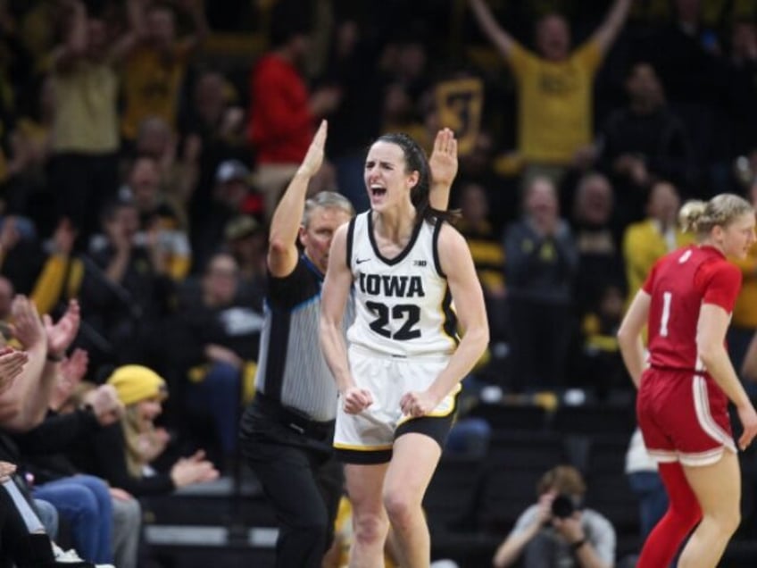 IOWA CITY, IOWA- JANUARY 13: Guard Caitlin Clark #22 of the Iowa Hawkeyes celebrates afte