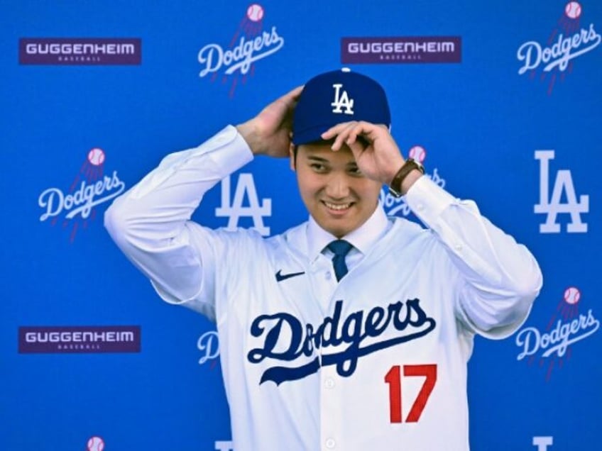 Japanese baseball player Shohei Ohtani attends a press conference on his presentation after signing a ten-year deal with the Los Angeles Dodgers at Dodgers Stadium in Los Angeles, California on December 14, 2023. Ohtani has signed a record-shattering $700 million deal with the Los Angeles Dodgers, the richest in North …