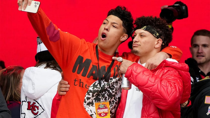 Jackson Mahomes and Patrick Mahomes celebrate