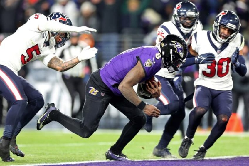 Lamar Jackson darts over for a touchdown in Baltimore's playoff victory over Houston