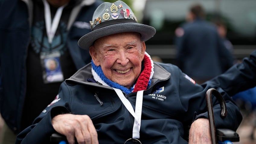 Larson smiles in France on the 79th anniversary of D-Day in 2023