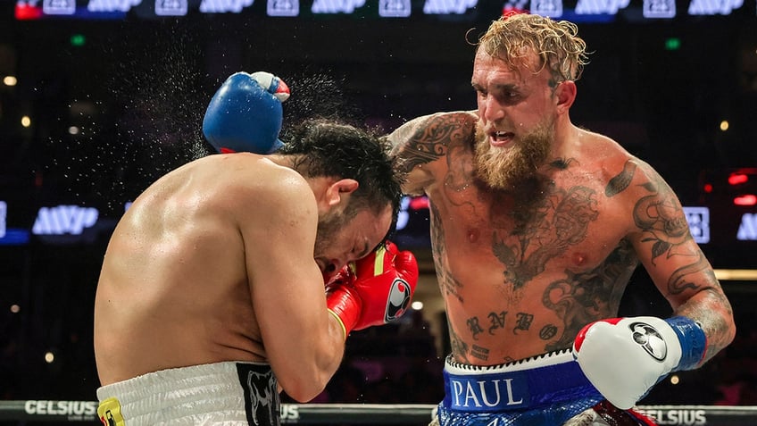 Jake Paul throws a punch