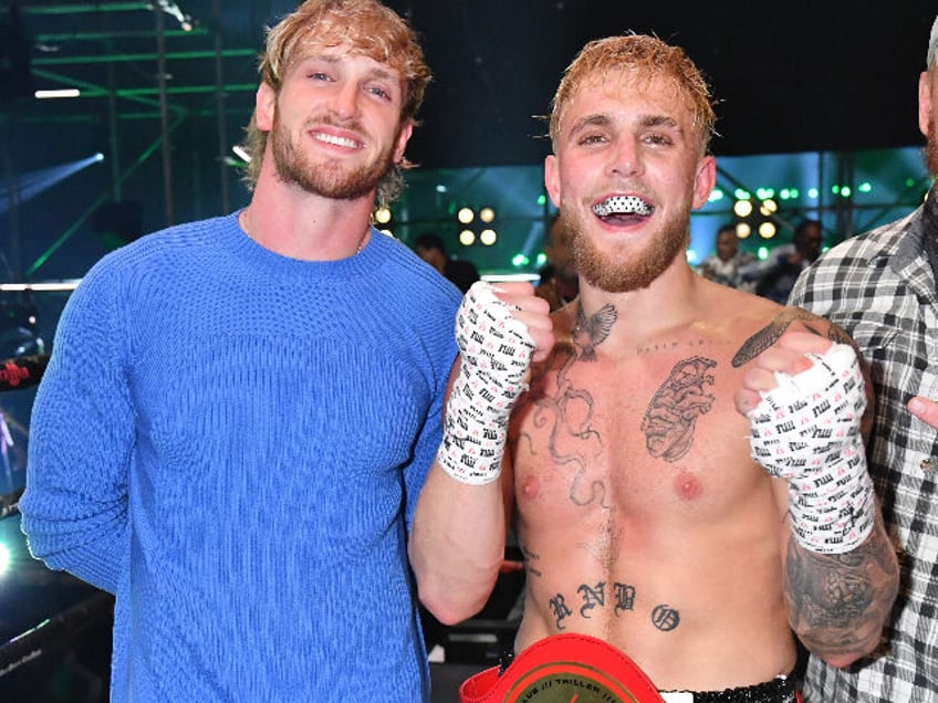 ATLANTA, GEORGIA - APRIL 17: Logan Paul poses with Jake Paul after defeating Ben Askren in