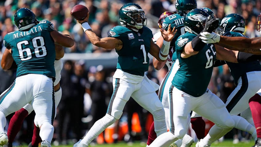 jalen hurts eagles fend off commanders in ot to stay undefeated