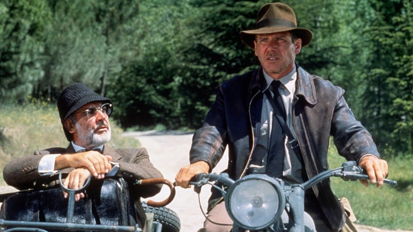 Sean Connery and Harrison Ford acting out a scene from the film Indiana Jones