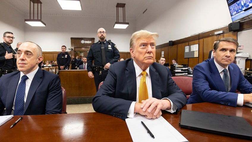 Donald Trump sits in the courtroom during his hush money trial