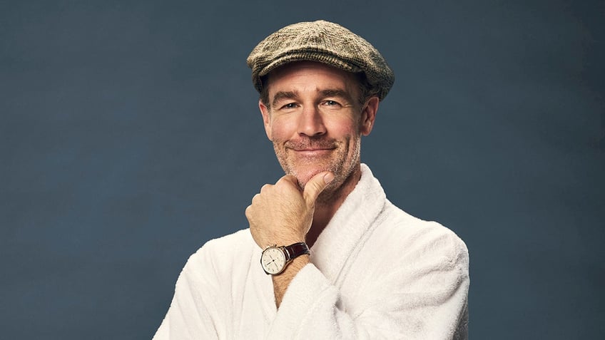 Close up of James Van Der Beek wearing a robe and hat