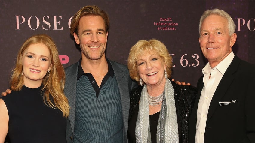 James Van der Beek smiles on red carpet with his family.