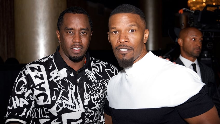 Jamie Foxx wears black and white shirt next to Sean Diddy Combs