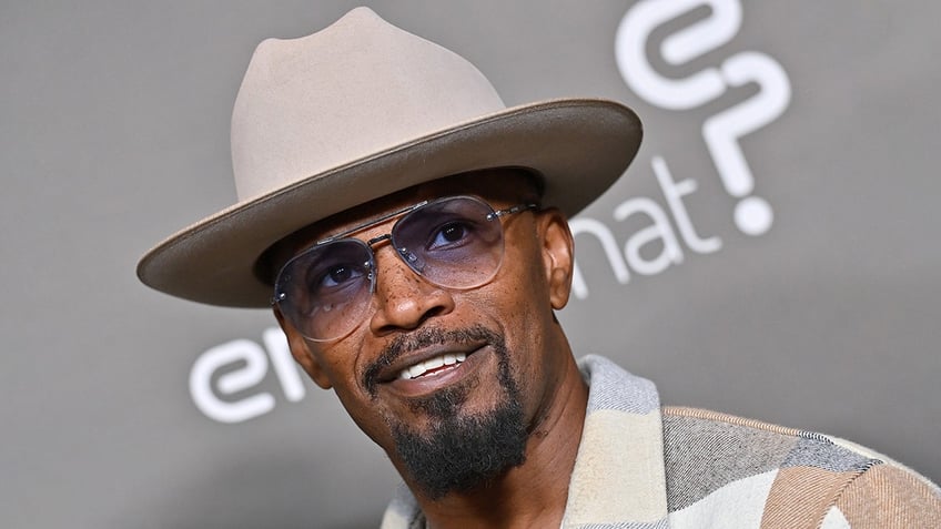 Close up of Jamie Foxx in a hat and sunglasses