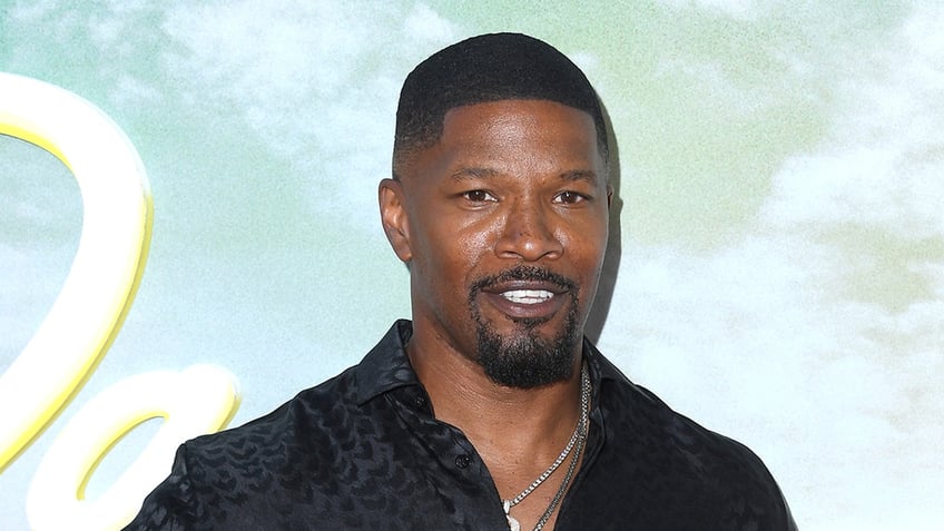 Actor Jamie Foxx sports black button down on red carpet