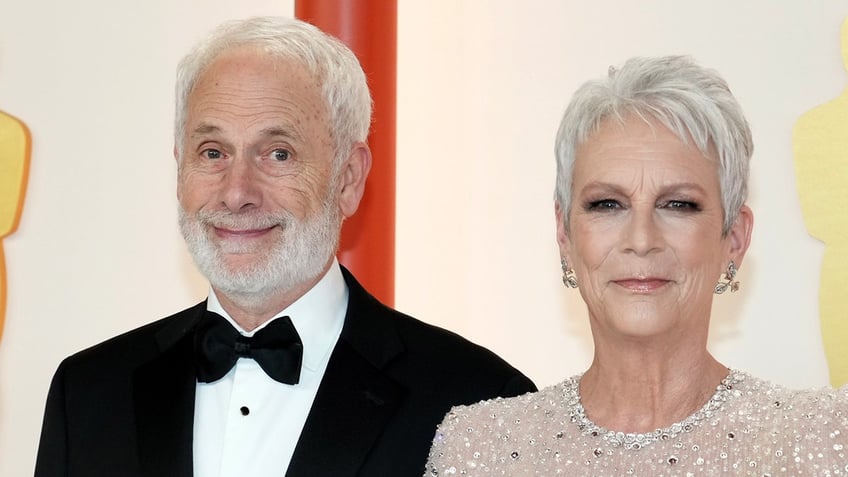 Jamie Lee Curtis walks red carpet with husband Christopher Guest.