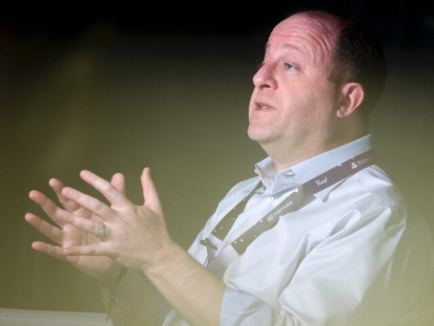 DENVER, CO - FEBRUARY 18: Colorado governor Jared Polis talks on a podcast at ETHDenver on