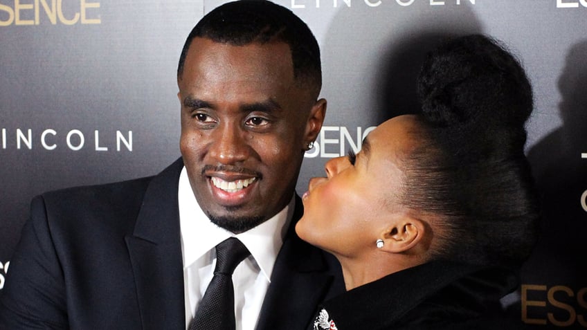 Sean "P. Diddy" Combs and Janelle Monae pose for a photo.