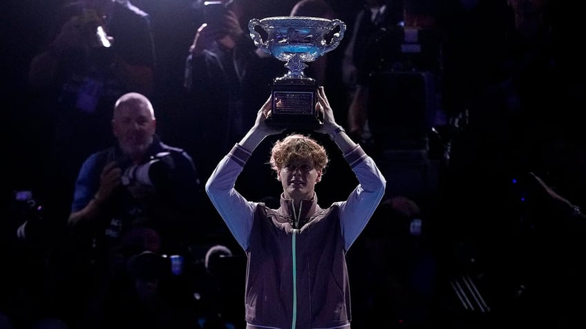 Jannik Sinner holds the trophy