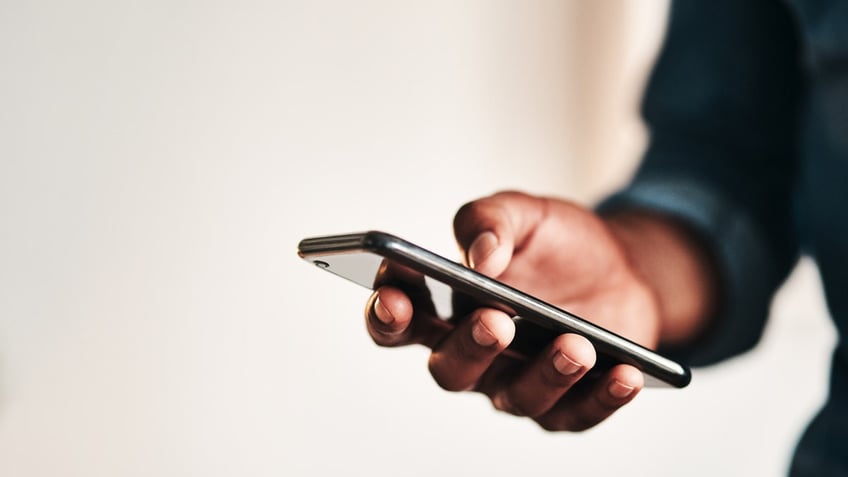 Person holding cell phone