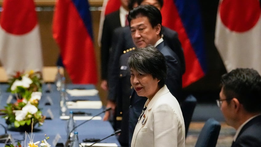 Japan Foreign Minister Yoko Kamikawa, second from right, and Japan Defense Minister Minoru Kihara wait for their counterparts to arrive