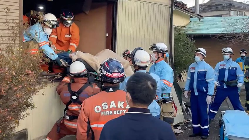 Woman being rescued