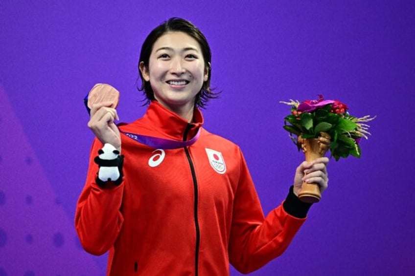 Rikako Ikee celebrates a bronze medal for the women's 50m butterfly at the Asian Games in