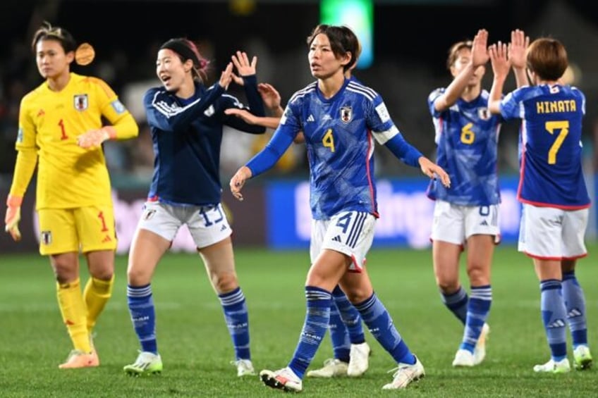 japan on verge of world cup last 16 spain primed to join them