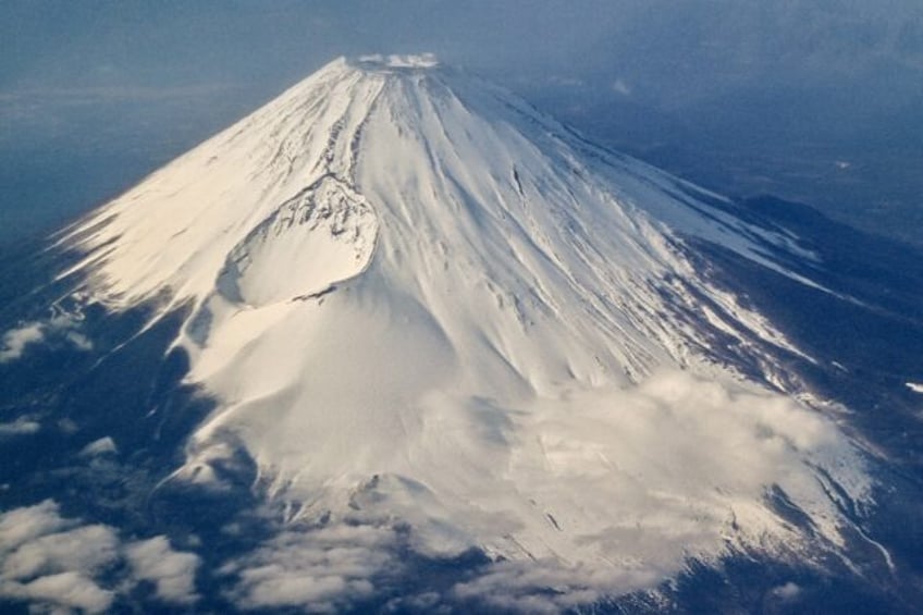 Tourists are flocking to take photos of Japan's highest peak Mount Fuji