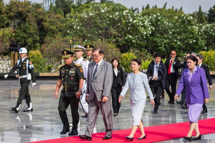 Japan's Prime Minister Shigeru Ishiba and his wife Yoshiko Nakamura attend a ceremony in J