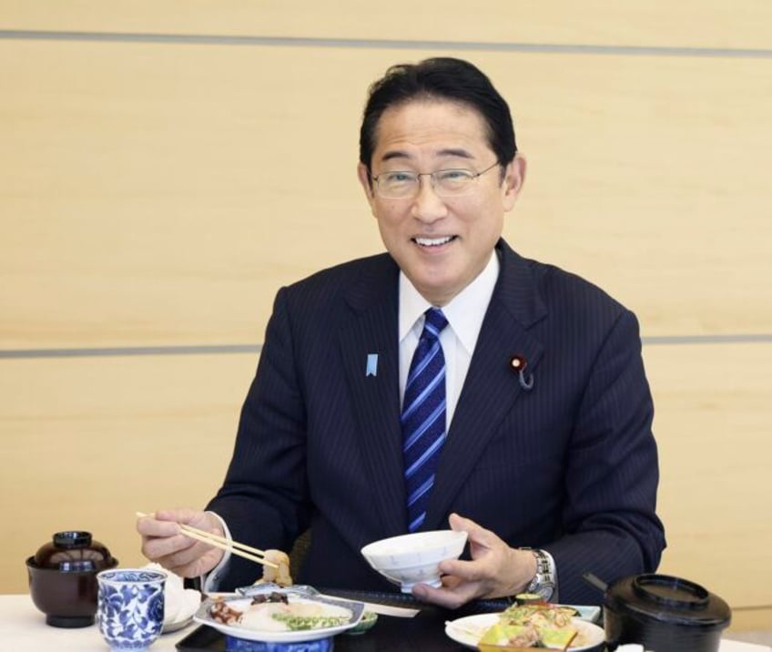 japanese ministers eat fukushima fish to show its safe after nuclear plant wastewater is discharged