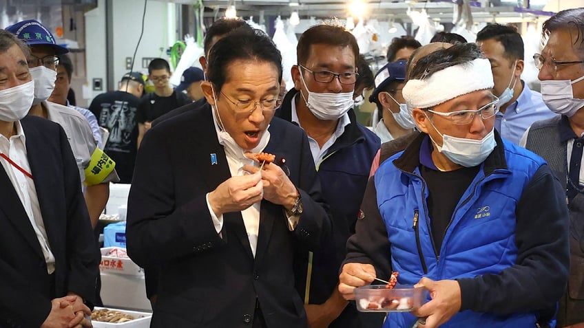 japanese prime minister eats fish from radioactive wastewater dump to demonstrate safety