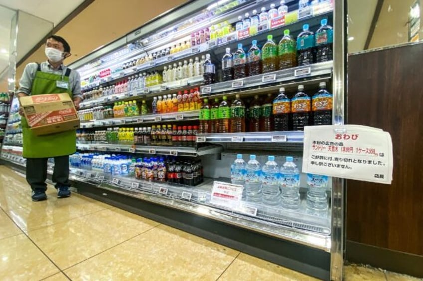 A sign telling customers the sale of water is rationed at a supermarket in Sumida district