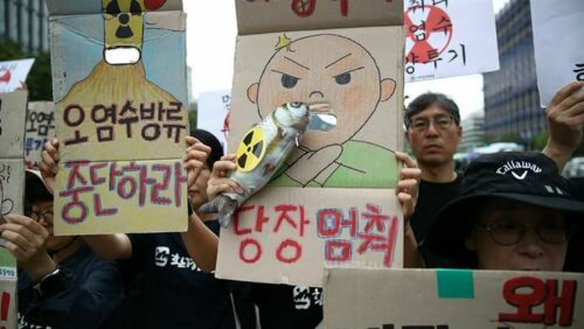 japans prime minister eats radioactive fish from fukushima waters