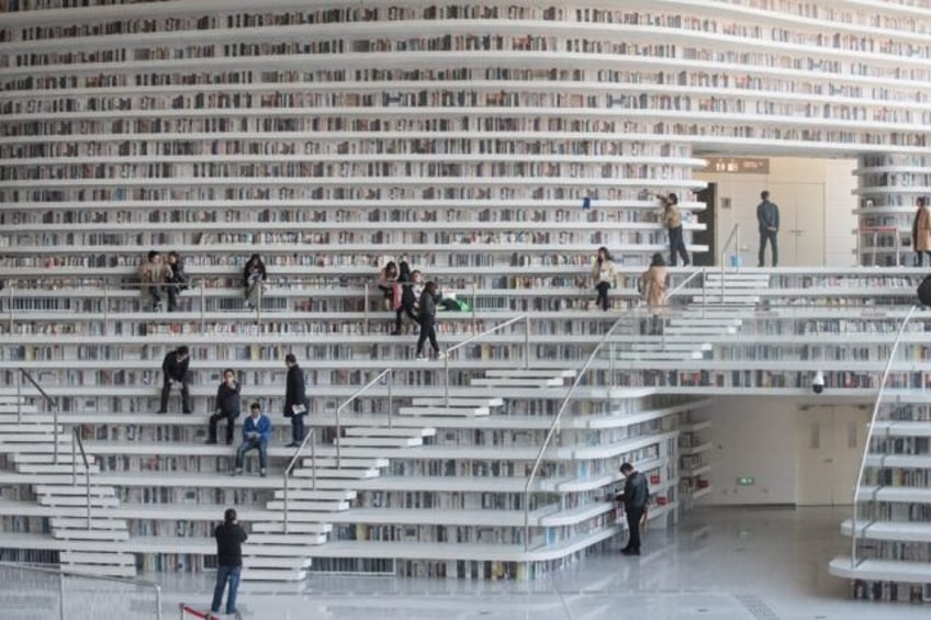 People visit the Tianjin Binhai Library in November 2017