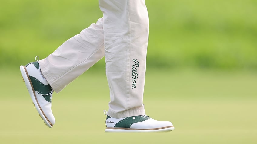 Malbon pants and shoes on Jason Day