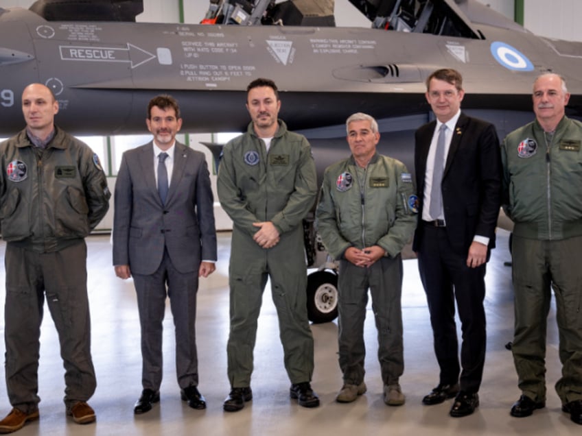 Argentina's Defense Minister Luis Alfonso Petri (3rd L), Denmark's Defense Minister Troels Lund Poulsen (2nd R) and delegation members pose in front of one of the F-16 planes Argentina is buying from Denmark during a press event of the sidelines of an agreement signing on the purchase of Danish F-16 aircraft at Skrydstrup Air Base, Denmark, on April 16, 2024. Argentina signed a contract to buy 24 Danish F-16 combat aircraft. (Photo by Bo Amstrup / Ritzau Scanpix / AFP) / Denmark OUT (Photo by BO AMSTRUP/Ritzau Scanpix/AFP via Getty Images)