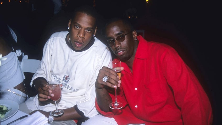 Diddy wears red shirt with Jay-Z at Fourth of July party